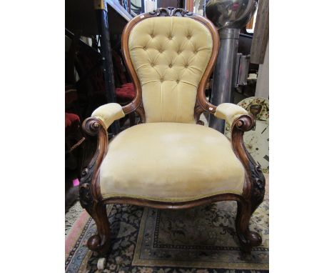 A Victorian walnut spoon back drawing room chair with carved and moulded show wood frame, with additional floral detail on ca