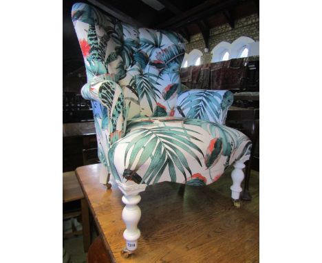Laura Ashley type button back lounge chair, with Hawaiin type palm print, on painted legs and brass castors