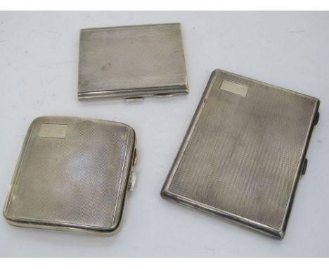 Three engine turned silver cigarette cases, 12.5oz approx