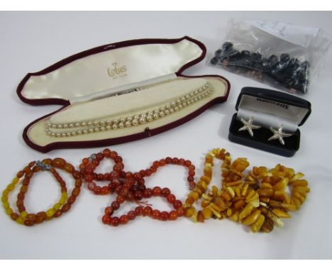 A mixed lot to include a pair of silver cufflinks in the form of starfish, two amber necklaces, a lotus pearl necklace with s