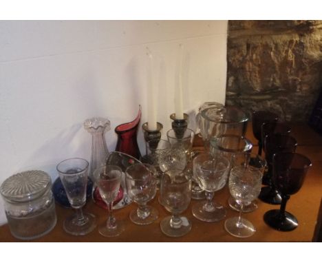 A collection of glassware to include four amethyst glass goblets, a merano type glass paperweight and scent bottle; together 