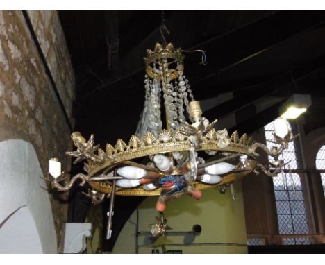 Continental gilt metal and prismatic drop ceiling light. with eight scrolled branches and eight light bulbs