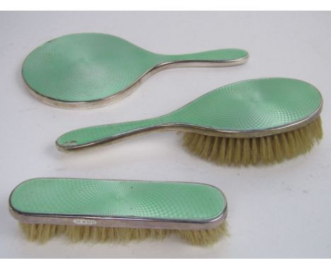 Three pieces silver and guilloche enamel dressing set comprising two brushes and a mirror, maker P & B Ltd (3)