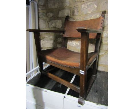 A small vintage oak framed occasional of fireside chair with dished tan leather upholstered seats and strap back, together wi