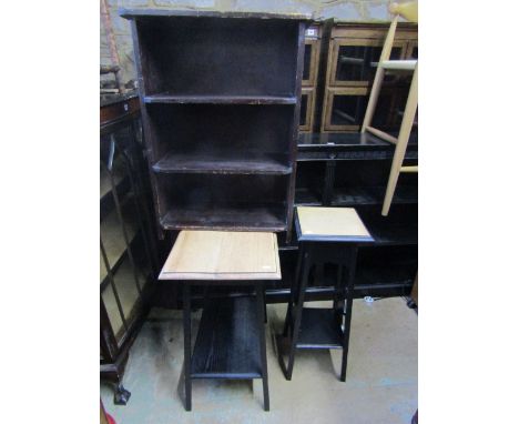 An Edwardian oak two tier occasional table of rectangular form with stripped top raised on a later ebonised painted square cu