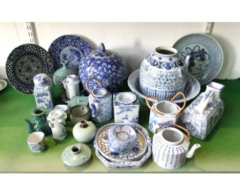 A quantity of mainly reproduction oriental blue and white decorated ceramics including a ginger jar and cover, a plate with p