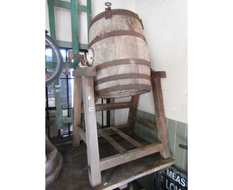 A vintage coopered oak and steel banded butter churn  and stand, made by R A Lister & Co Ltd, Dursley, England