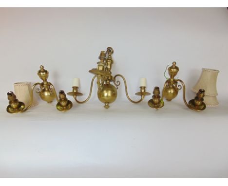 A box containing a quantity of Dutch brass light fittings to include a three branch ceiling light and two twin branch wall sc
