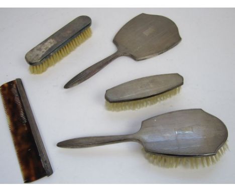 Four piece harlequin engine turned silver dressing set comprising two brushes, hand mirror and comb