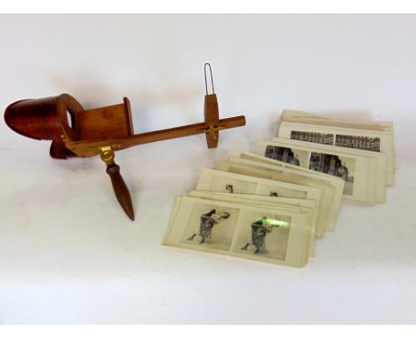 Wooden stereoscope with two sets of vintage cards to include pin up girls, soldiers and famous places