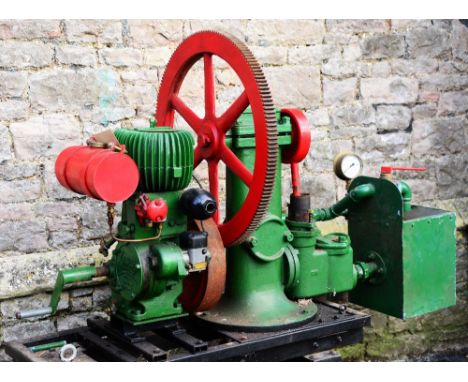 A Wolseley stationary engine/water pump type WDII, 1.5 hp, 700 rpm, engine number 19283, mounted on a four wheeled trolley/ha