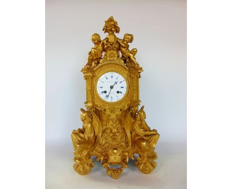 Impressive French cast ormolu figural mantle clock, by Bourdain of Paris, the two train 8cm enamelled dial in a well cast cas