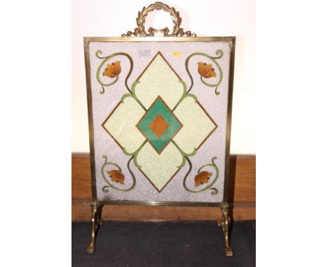 An early 20th Century brass framed firescreen inset glass mosaic panel, 18" wide