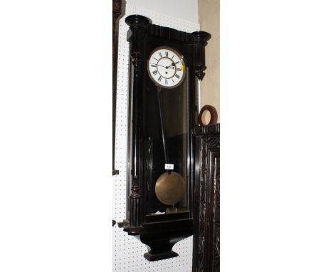 A Vienna type wall clock in ebonised case with eight-day movement