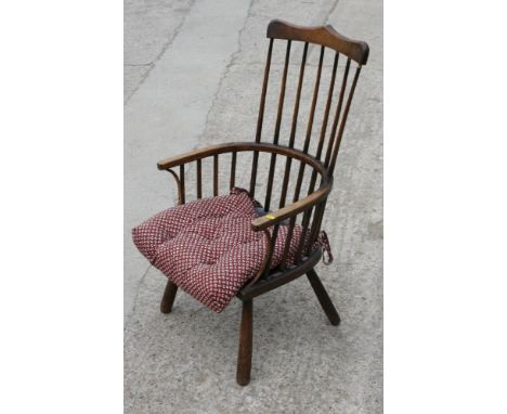 A child's 19th Century stick back elbow chair with elm panel seat