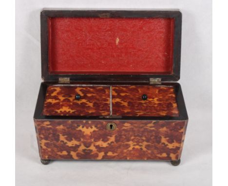 A 19th Century rosewood sarcophagus-shaped two-division tea caddy with pewter stringing and four ball feet, 12" wide
