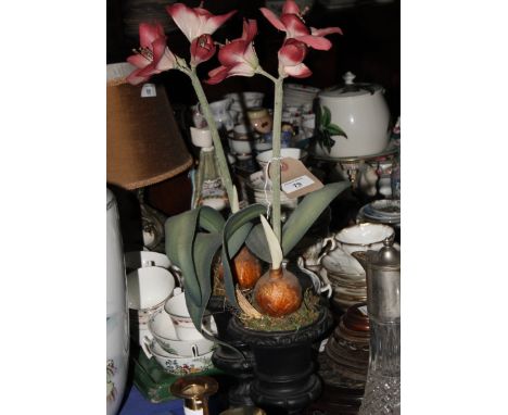 A pair of cast iron urns with artificial flowers, four Chinese wooden vase stands, one inset marble panel, and three wooden b