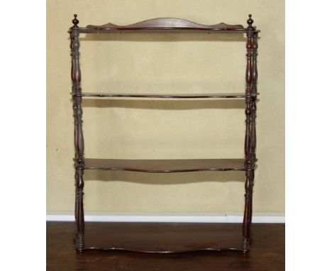 A Georgian design graduated four-tier mahogany wall shelf, 24" wide
