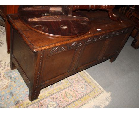 A 17th Century design oak blanket box with three panel front, old iron lock and key, 54" wide