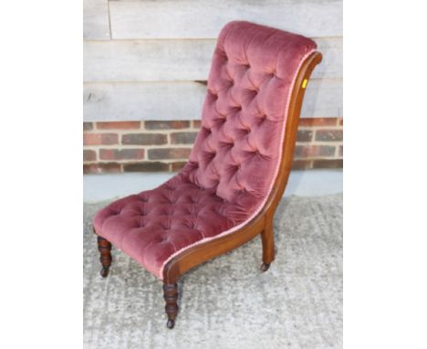 A 19th Century hammock seated nursing chair, button upholstered in a rose velour
