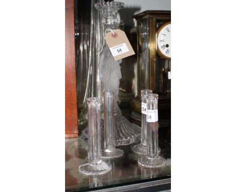 A glass candlestick with frosted stem moulded as a classical maiden on reeded circular base, 12" high, and a set of four glas