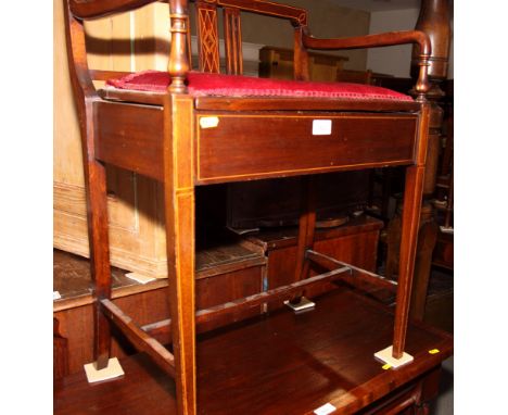 An Edwardian mahogany box seat piano stool, on square taper supports