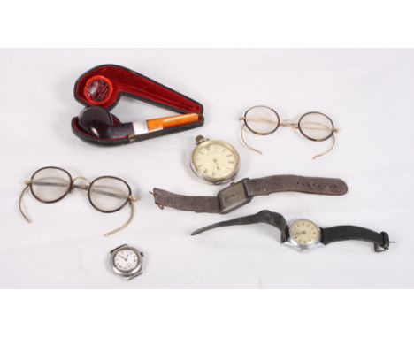 A silver cased pocket watch, three wristwatches, various, two pairs of spectacles and a cased silver mounted pipe with amber 