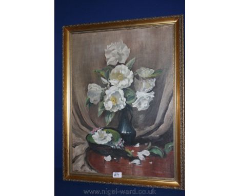 An Oil on board depicting flowers on a table by R. McKenzie Johnson