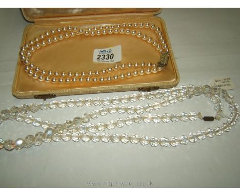A boxed two string pearl Necklace together with a large crystal Necklace - 44'' long.
