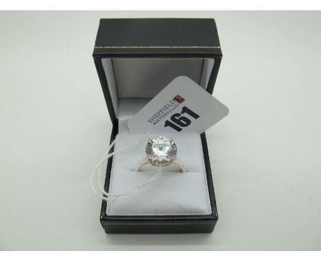 A Modern Large Single Stone Dress Ring, four claw set, stamped "925" (finger size R1/2). 