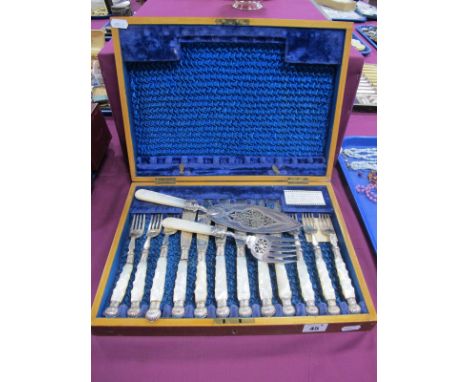 A Highly Decorative Set of Six Mother of Pearl Handled Fish Knives and Forks, with hallmarked silver ferrules, together with 