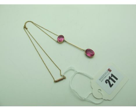 A Vintage Drop Necklace, oval collet set stamped "9ct", on fine chain (knotted). 
