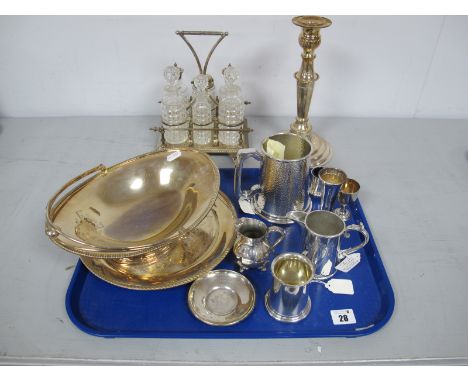A Decorative Plated Condiment Stand, firtted with assorted glass bottle (damages); plated swing handled dish, candlestick, a 