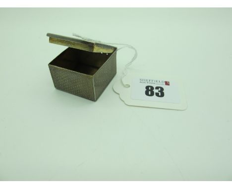 A Small Hallmarked Silver Box, NM(?), London 1903, allover engine turned with seven pinholes below the hinge, 3.2cm wide. 