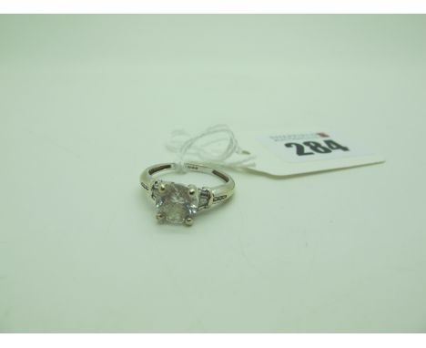 A QVC Modern Single Stone Dress Ring, claw set between inset shoulders, stamped "585" (finger size O) (2.6grams). 