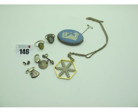Wedgwood Blue and White Jasperware Oval Brooch, a Modernist style snowflake pendant, a Wedgwood green and white Jasperware ri