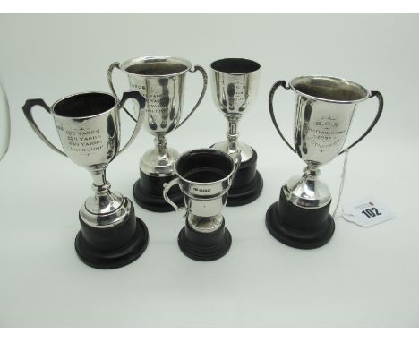 Five Minature Hallmarked Silver Trophy Cups, each on socle base. (5) 