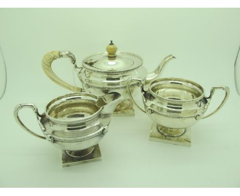 A Matched Hallmarked Silver Three Piece Bachelors Tea Set, teapot Messrs Hutton, Birmingham 1913 (marks rubbed), jug and suga