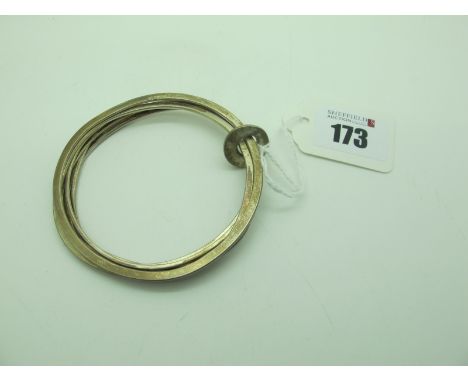 A Millennium Hallmarked Silver Bangle, composed of six flat bangles joined by a circular disc.Lot 173 - 6½cm inner diameter 