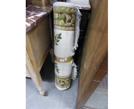 AN INDIAN HEARTH RUG, OF AUBUSSON DESIGN ON A CREAM FIELD, A POUFFE AND A TUBULAR METAL FRAMED LEG REST 