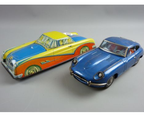 A German tinplate friction drive motor car by Phillip Niederneire, brightly coloured with 'PN' to the number plates, marked t