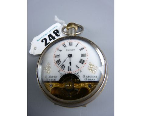 An eight day Swiss open faced pocket watch in a white metal case, gilt chased movement cover and decorative white enamel dial