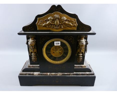 A large Victorian black slate and veined marble mantel clock, architecturally styled with gilt metal mounts and highlighted c