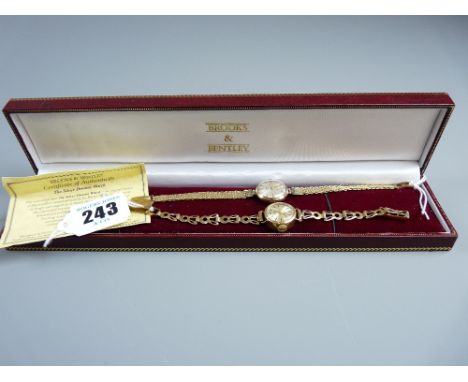 A lady's nine carat gold encased circular dial Rotary wristwatch with nine carat gold bracelet and a lady's nine carat gold e