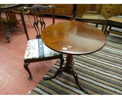 An antique mahogany circular tilt top tripod table with a 61 cms diameter top and a mahogany antique style pierced splatback 