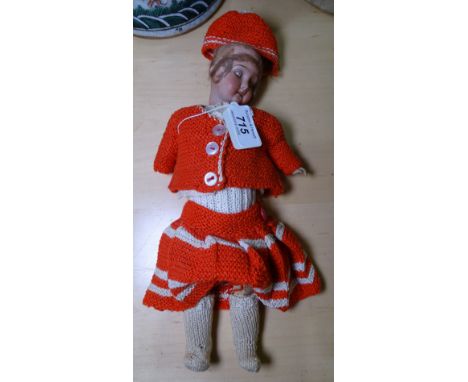 A small German Vintage porcelain-headed doll, with composition limbs, 11" 