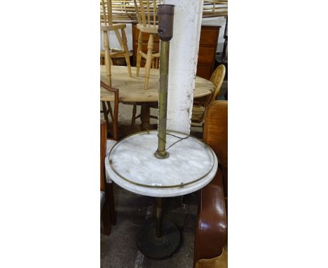 A brass standard lamp with white marble shelf 