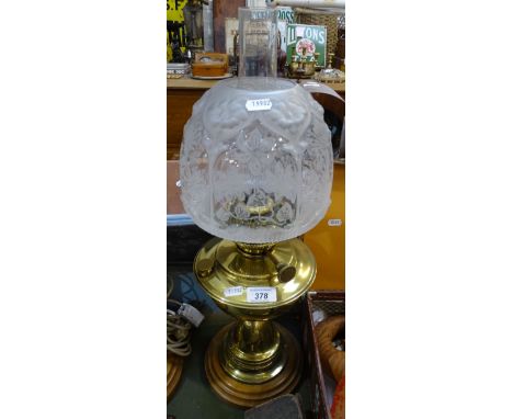 A Victorian polished brass oil lamp, with chimney and shade, 22.5" 