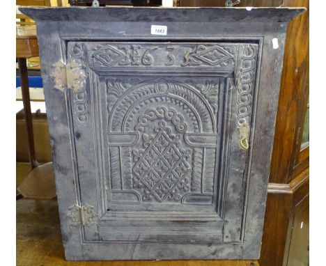 A small Antique chip-carved hanging corner cupboard, with single panel door, W65cm 