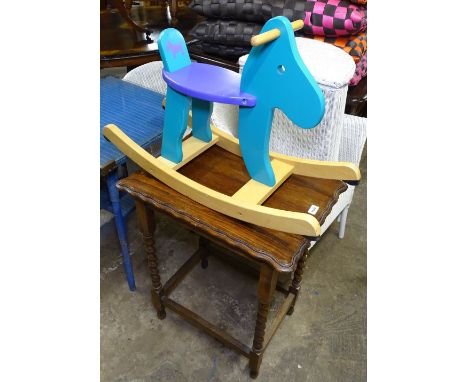 An oak barley twist occasional table, and a child's painted rocking horse 